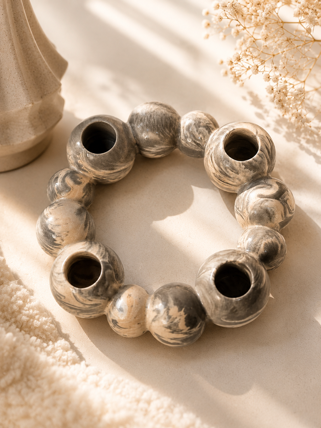 One of our favourite décor pieces.  A handcrafted marbled candle holder designed to bring warmth and style, Elegant • Versatile • Beautiful